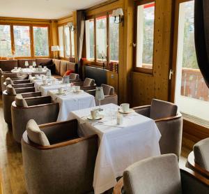 a row of tables and chairs in a restaurant at Coeur des Neiges in Saint-Gervais-les-Bains