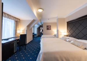 Ένα ή περισσότερα κρεβάτια σε δωμάτιο στο Pytloun Old Armoury Hotel Prague, Stará Zbrojnice
