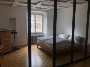 Katil atau katil-katil dalam bilik di Albergo Diffuso Porrentruy