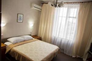 Кровать или кровати в номере Отель Кишинев
