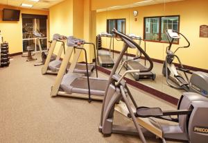 a gym with several tread machines in a room at Hyatt House Bentonville Rogers in Rogers