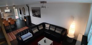 Posezení v ubytování Appartement Duplex à l'entrée de Ciney Avec emplacement vélos