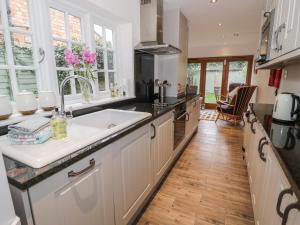 a kitchen with a sink and a counter top at 24 College Lane in Stratford-upon-Avon