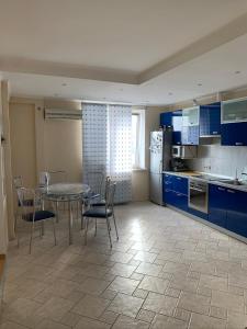 A kitchen or kitchenette at Bright room near International Exhibition Centre