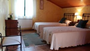Posteľ alebo postele v izbe v ubytovaní Casa Ameneiros