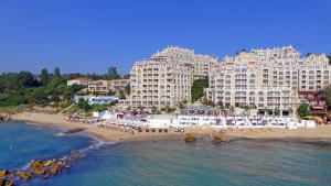 a view of a beach with two large buildings at La Mer Penthouse in Varna City