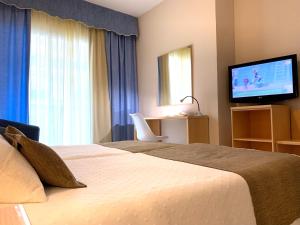 Postel nebo postele na pokoji v ubytování Hotel Restaurant Llansola