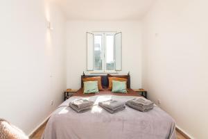 Postel nebo postele na pokoji v ubytování Casa BrancAzul