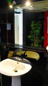 a bathroom with a sink and a fishtank at I Am Here - Gioia66 in Milan