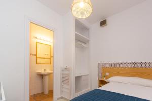 Letto o letti in una camera di BOHEMIA SANLUCAR
