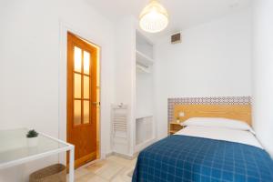 Letto o letti in una camera di BOHEMIA SANLUCAR