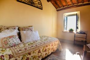 A bed or beds in a room at La Casa del Sole