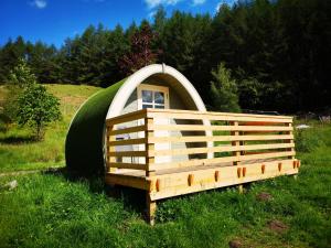 a dome house with a window in the grass at Craskie Glamping Pods in Inverness