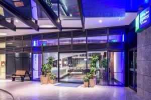 a building with potted plants inside of it at Holiday Inn Express & Suites Bogota Zona G By IHG in Bogotá