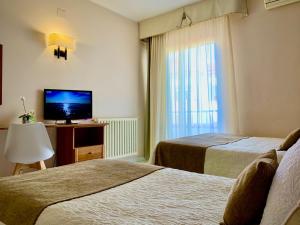 Postel nebo postele na pokoji v ubytování Hotel Restaurant Llansola