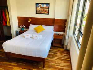 Ένα ή περισσότερα κρεβάτια σε δωμάτιο στο Hotel Daylu