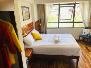 Ένα ή περισσότερα κρεβάτια σε δωμάτιο στο Hotel Daylu