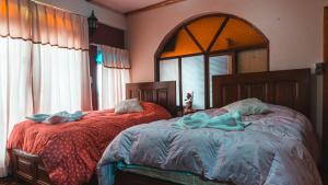 Ένα ή περισσότερα κρεβάτια σε δωμάτιο στο Hostal La Magia de Uyuni