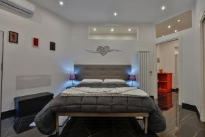 a bedroom with a large bed in a room at Residenza Napoli Centrale in Naples