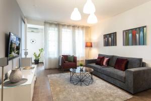 a living room with a couch and a table at Modern Apartment near Faculty of El Engineering in Zagreb