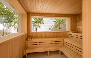 a sauna with a window and a bench in it at Borgo Egnazia in Savelletri di Fasano