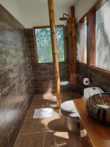 a bathroom with a toilet and a sink at Villa Maria Tayrona, a Kali Hotels in Los Naranjos