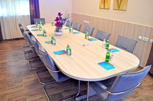 a conference room with a long table and chairs at Hotel Mar Garni in Belgrade