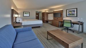 a hotel room with a bed and a desk at Holiday Inn Express & Suites Broomfield, an IHG Hotel in Broomfield
