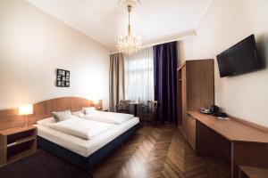 Posteľ alebo postele v izbe v ubytovaní BoutiqueHOTEL Donauwalzer