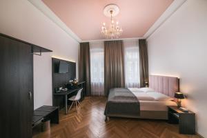 Posteľ alebo postele v izbe v ubytovaní BoutiqueHOTEL Donauwalzer