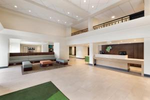 a lobby of a hospital with a waiting room at Holiday Inn Houston Intercontinental Airport by IHG in Houston