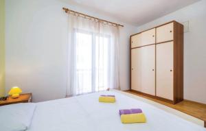 Cama ou camas em um quarto em Apartments 501 - Rab island oasis retreat