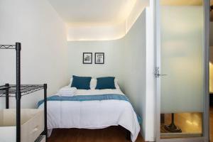 Letto o letti in una camera di Hostal Top Location ideal para viajeros Polanco