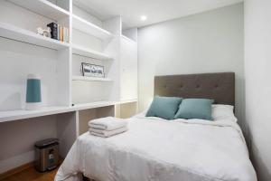 Letto o letti in una camera di Hostal Top Location ideal para viajeros Polanco