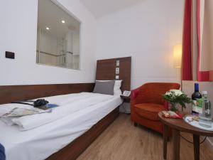 
Ein Bett oder Betten in einem Zimmer der Unterkunft Hotel Westfalia
