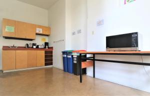 a room with a desk with a computer on it at The Grey Nuns Residence by Concordia University in Montreal