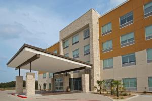 a rendering of the front of a building at Holiday Inn Express & Suites - Brookshire - Katy Freeway, an IHG Hotel in Brookshire