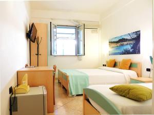 Postel nebo postele na pokoji v ubytování Hotel Porto Badisco