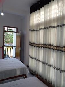 Letto o letti in una camera di Mangohut Joy