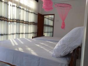 Letto o letti in una camera di Mangohut Joy