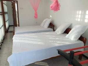 Letto o letti in una camera di Mangohut Joy