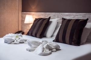 A bed or beds in a room at Hotel Ancora