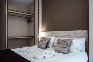 A bed or beds in a room at Hotel Ancora