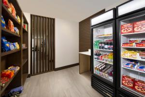 a room with a refrigerator filled with lots of food at Holiday Inn Express & Suites New Braunfels, an IHG Hotel in New Braunfels
