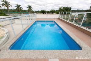 a swimming pool on the roof of a building at Flat Suites Pampulha - AP 122 - Particular in Belo Horizonte