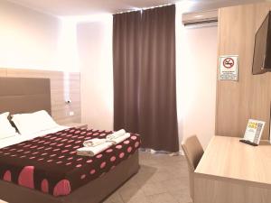 Voodi või voodid majutusasutuse Academy Hotel toas
