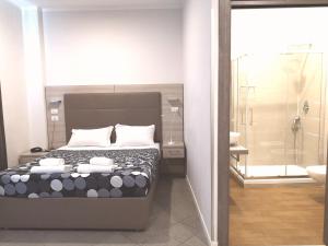 Voodi või voodid majutusasutuse Academy Hotel toas