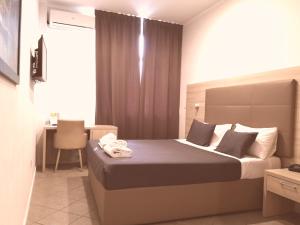 Voodi või voodid majutusasutuse Academy Hotel toas