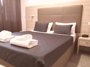 Voodi või voodid majutusasutuse Academy Hotel toas