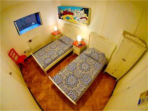 Cama ou camas em um quarto em Hostal Providencia